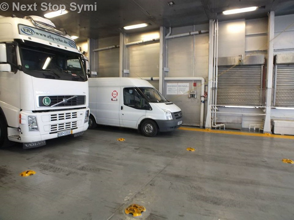 Dwarfed by the big trucks on the ferry