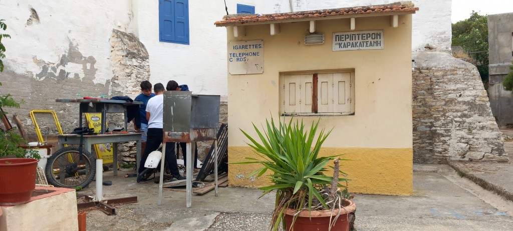 Meanwhile, essential bike repairs take place behind the bike shed... I mean the kiosk.