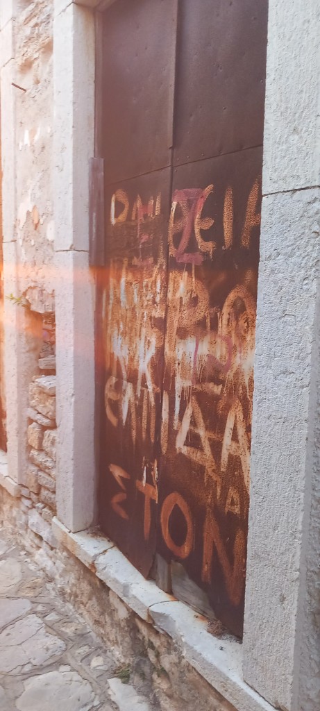 I love this door, though I;ve never got around to working out what it says.