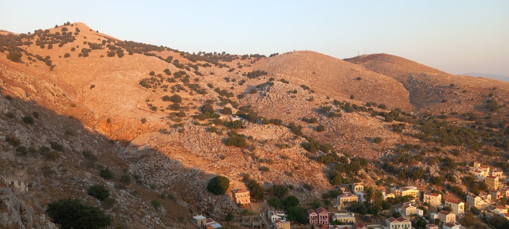 First rays of daylight on the hills.